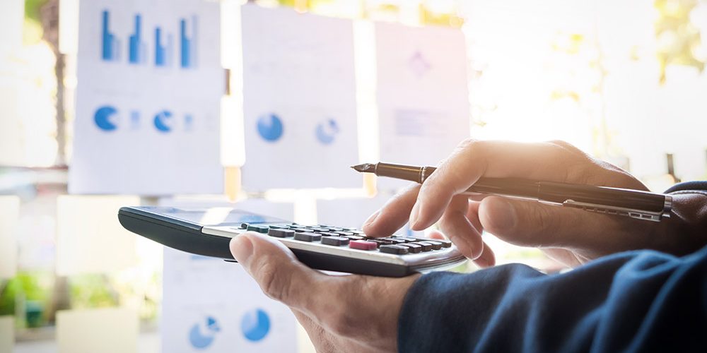 Business finance man calculating budget numbers, Invoices and fi