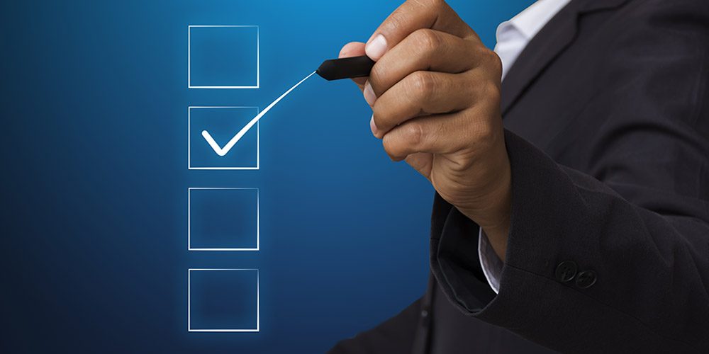 Business man with pen mark the checkbox,Check the accuracy